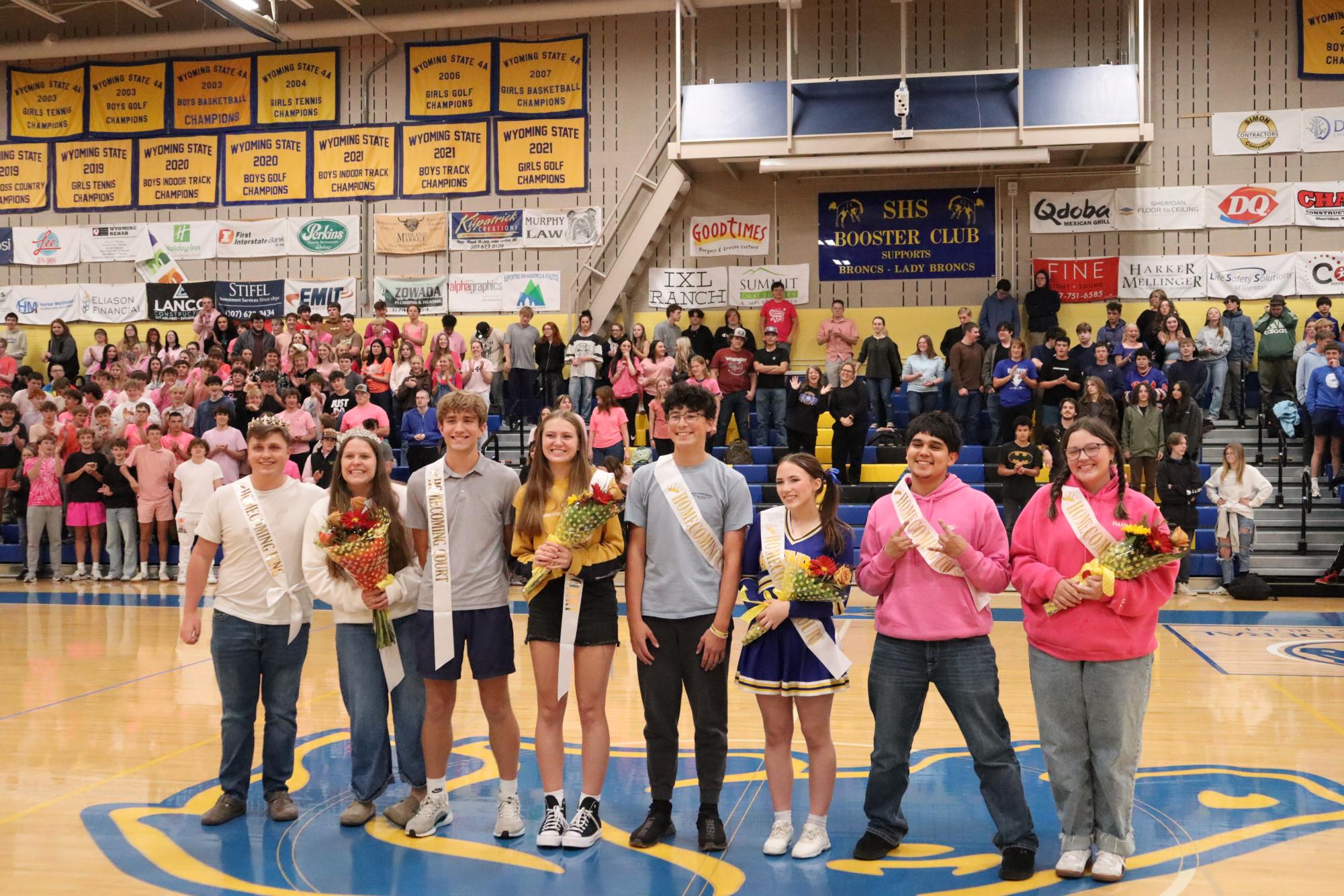 Homecoming royalty poses for a photo at the homecoming pep assembly. (Zane Doyle) | SHS Spirit Week 2024