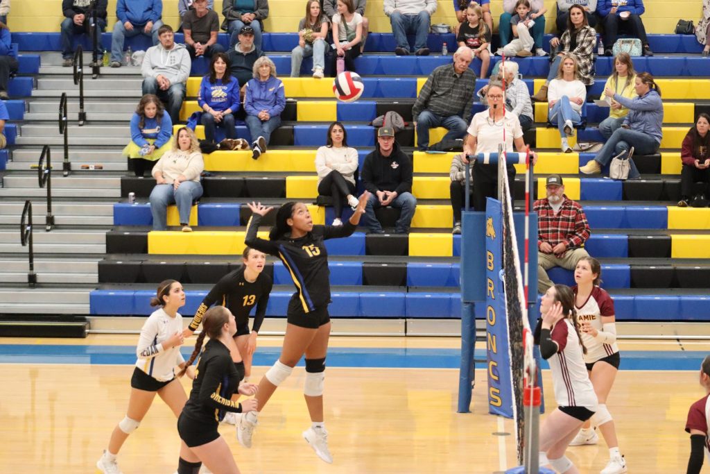 Sophomore Chalaya Bales jumps to spike the ball at the homecoming volleyball game. (Brian Rizer) | SHS Ocksheperida