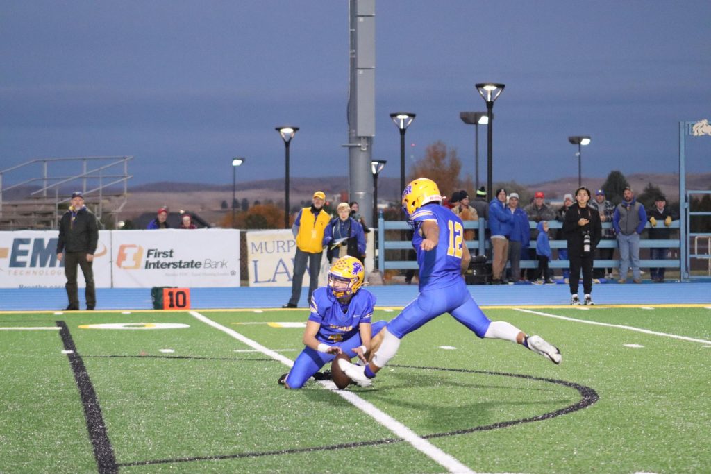 Ty Gilbertson prepares to kick a field goal at the homecoming football game. (Brian Rizer)