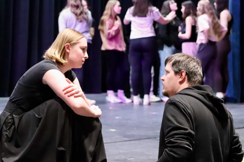 First time director A. J. Longhurst works with his daughter sophomore Bella Longhurst during musical rehearsal. (Photo Brian Rizer)