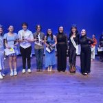 First, second, and third place winners of the third division accept their trophies and scholarship money. (Courtesy Jennifer Kahm)