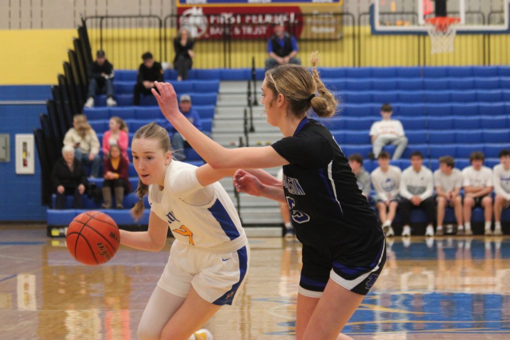Ella Bilyeu dribbles around thunder basin defender in a home game Saturday Feb. 1, 2025. (Courtesy Mia Katschke)