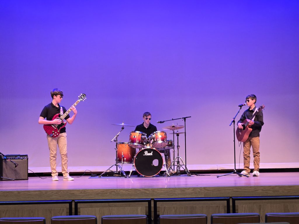 Kellen Medill, Emmett Craft, and James Craft played country song “Sunshine of Your Love” and placed first in the second division. (Zane Doyle)